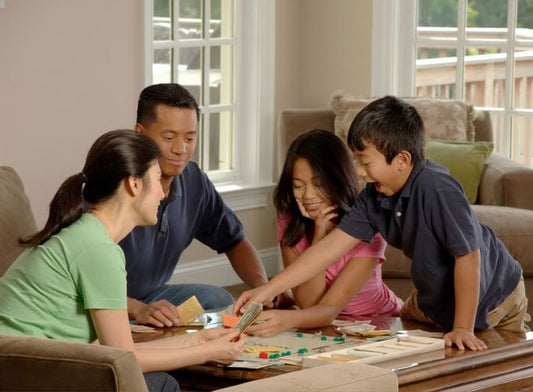 family playing board games